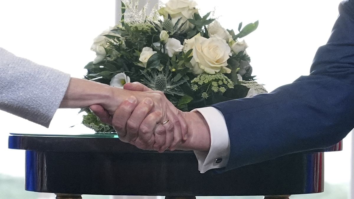 Ursula von der Leyen and Donald Trump at a podium during US EU trade tariff negotiations