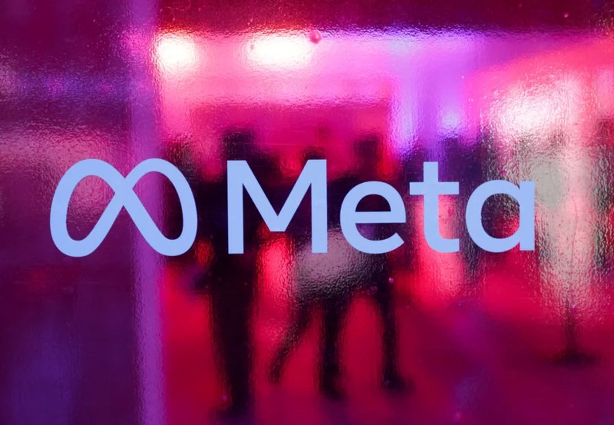 The Meta logo on display at a company event, seen through patterned glass. Source: Reuters via Yahoo Finance