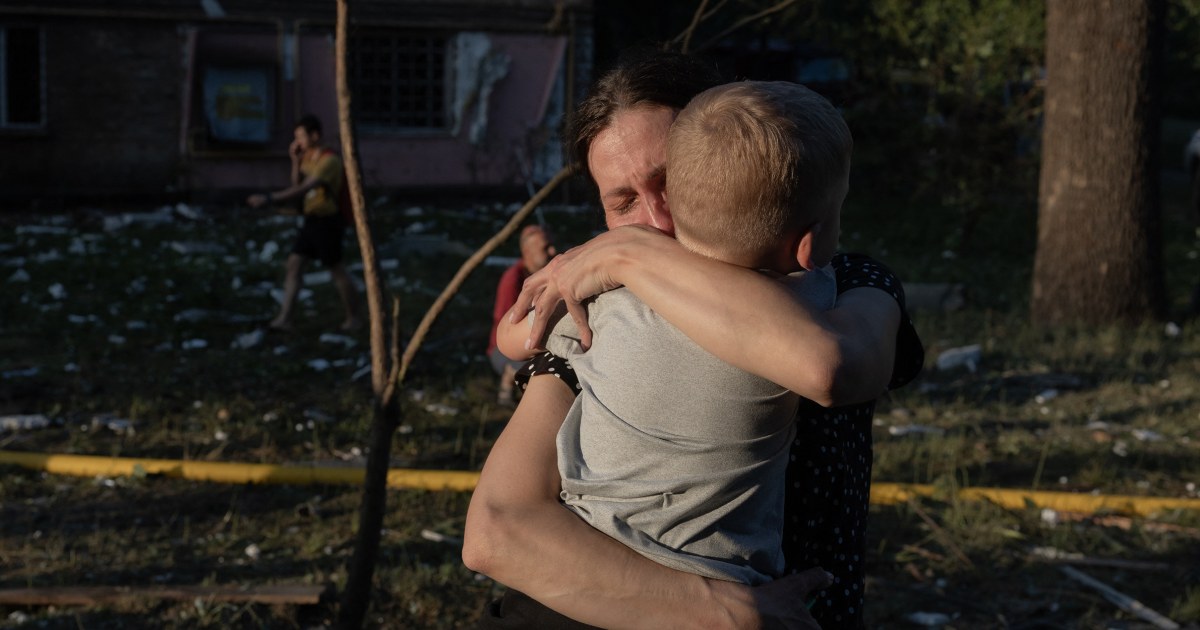 Rescue workers searching a collapsed Kyiv apartment building after a Russian missile and drone strike